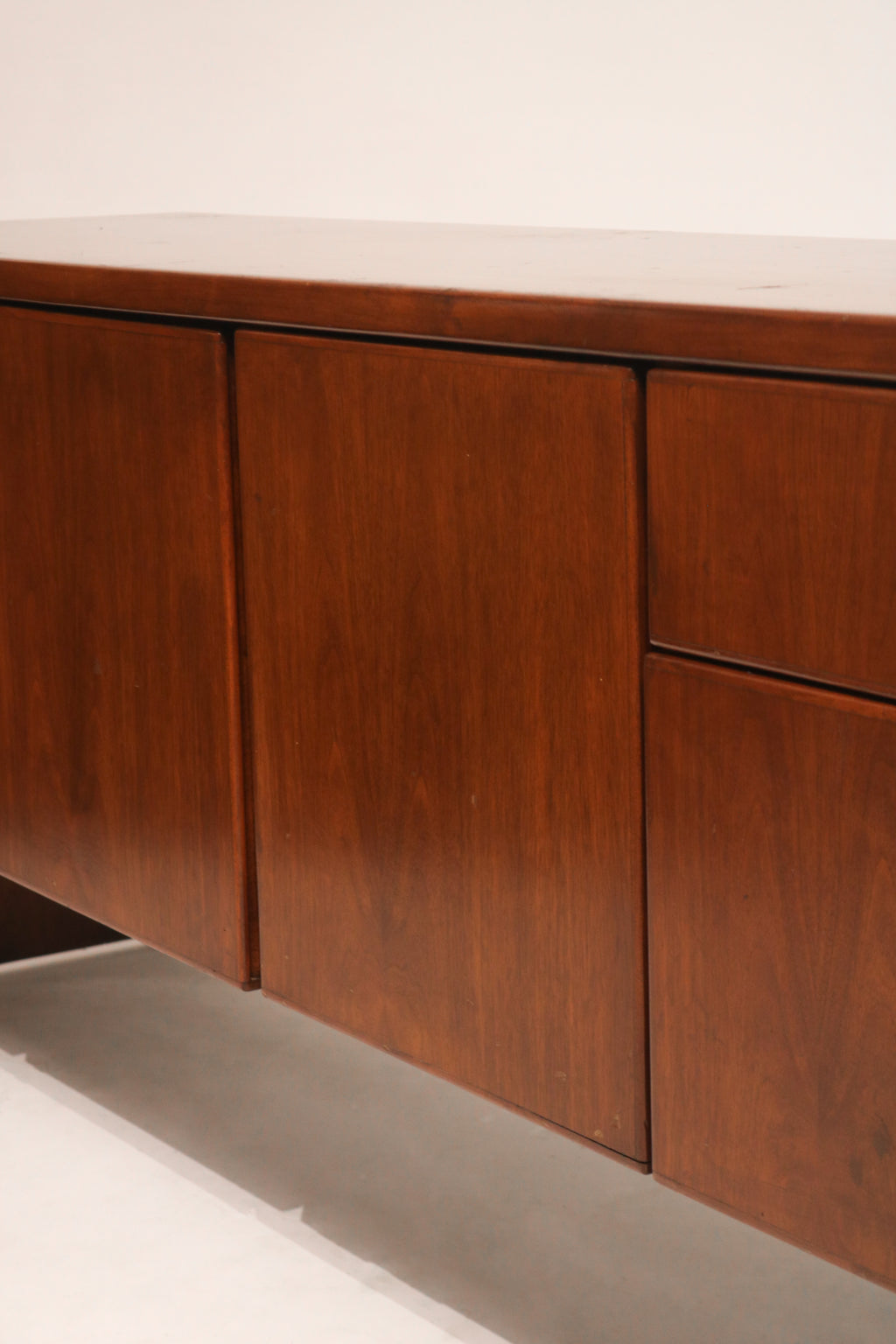 Detail of front drawers showing original handles and high-quality wood construction