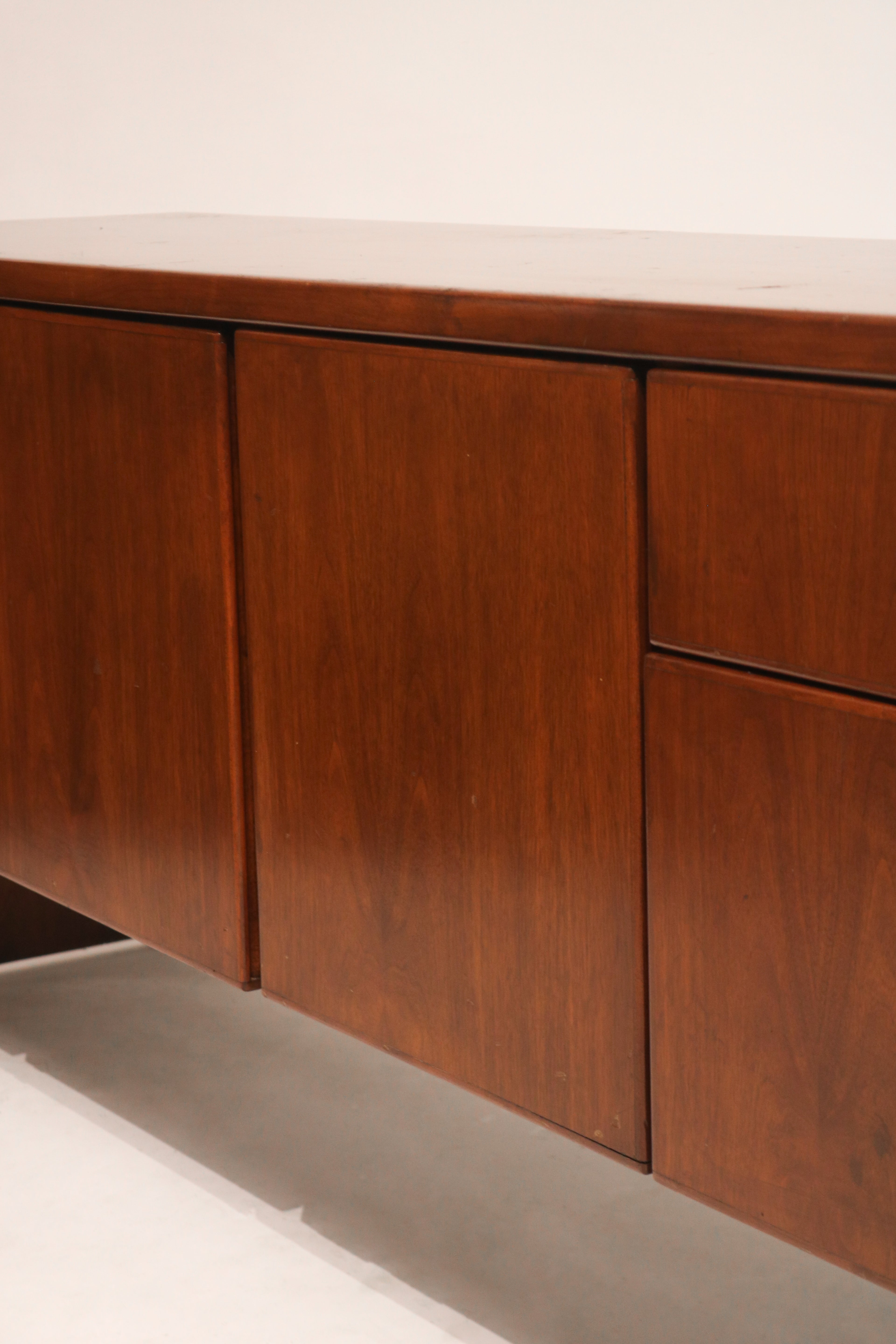 Detail of front drawers showing original handles and high-quality wood construction