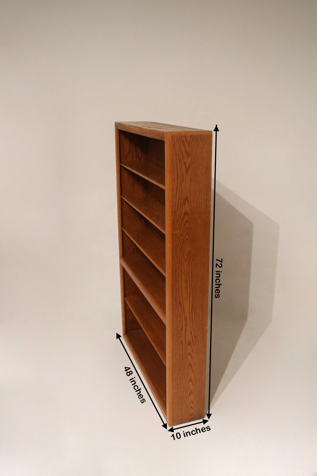 Side profile showing height and silhouette of vintage MCM wood cabinet