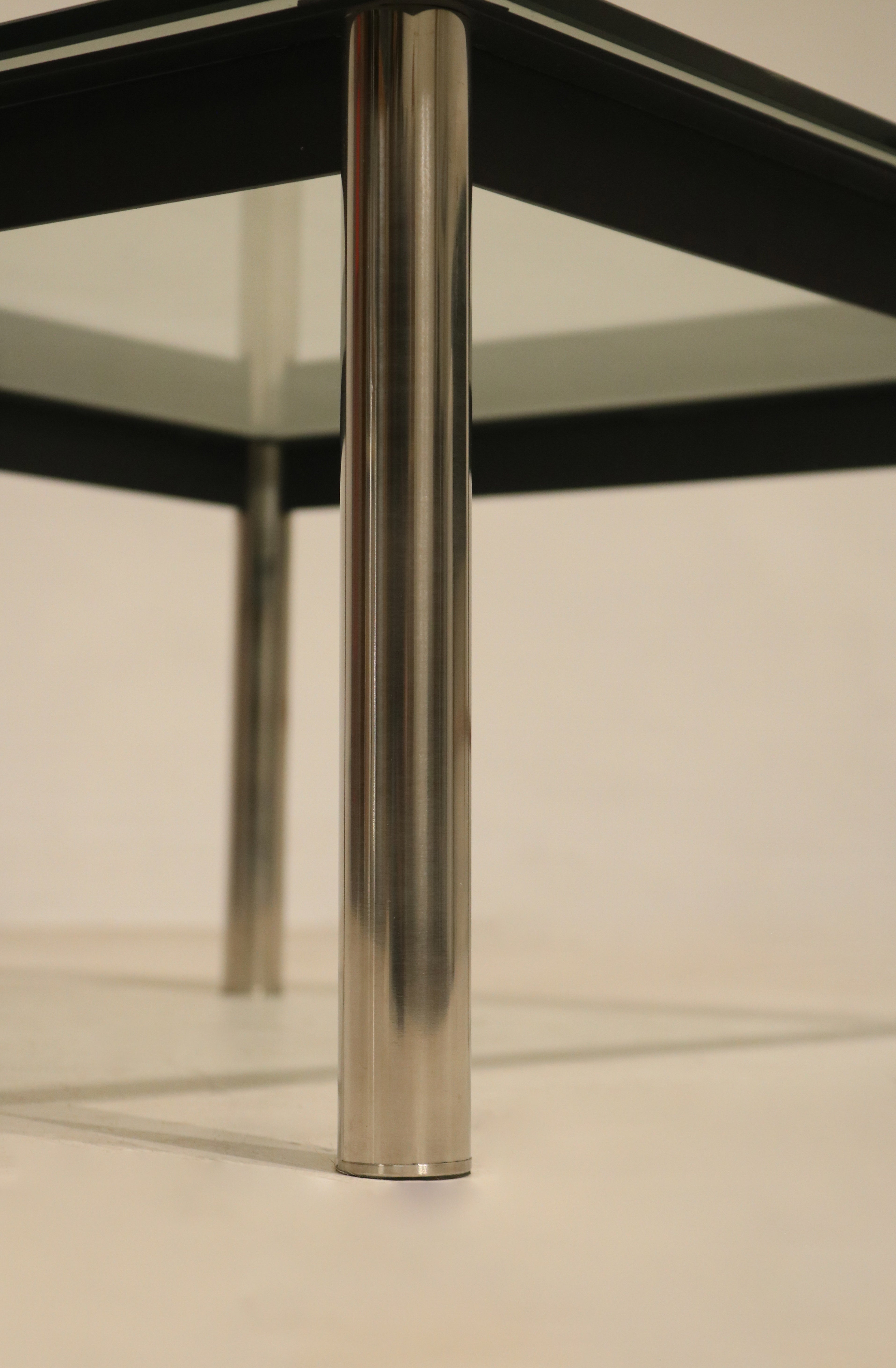 Close-up shot of leg wear on steel base, emphasizing vintage character and authenticity