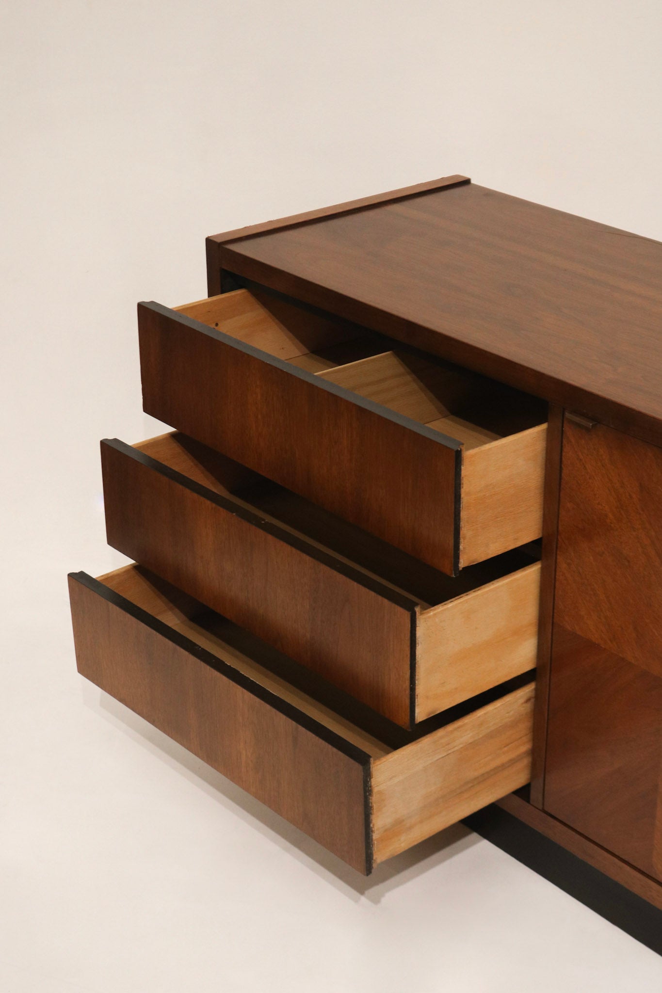 Stylistic close-up of finish sheen and color depth on Walnut Wood Dresser Credenza, ideal vintage storage piece for NYC homes