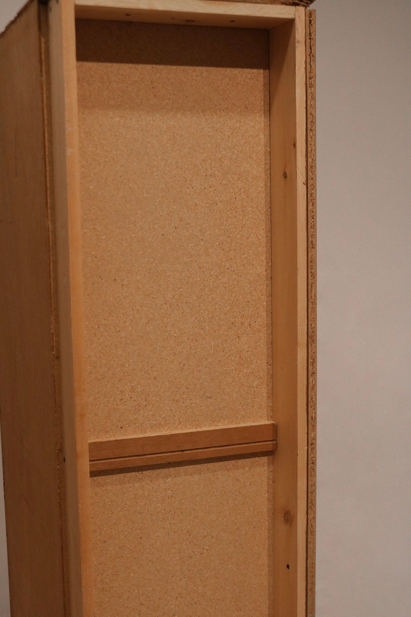 Close-up of teak wood grain and smooth finish on top surface of the vintage dresser