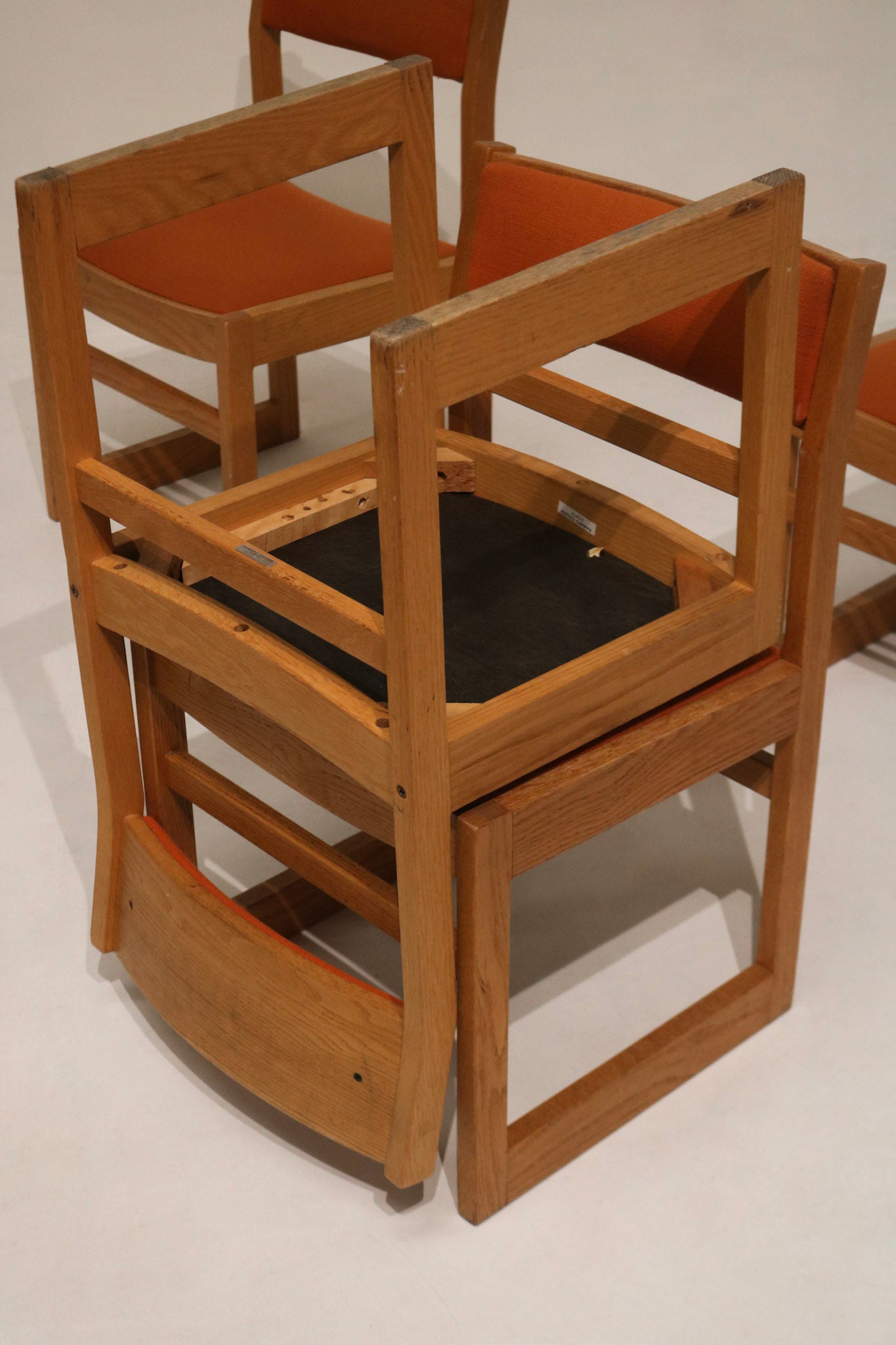 Rear view of Jasper chair showing light oak slatted back, visible wood grain and subtle aged patina consistent with vintage pieces.