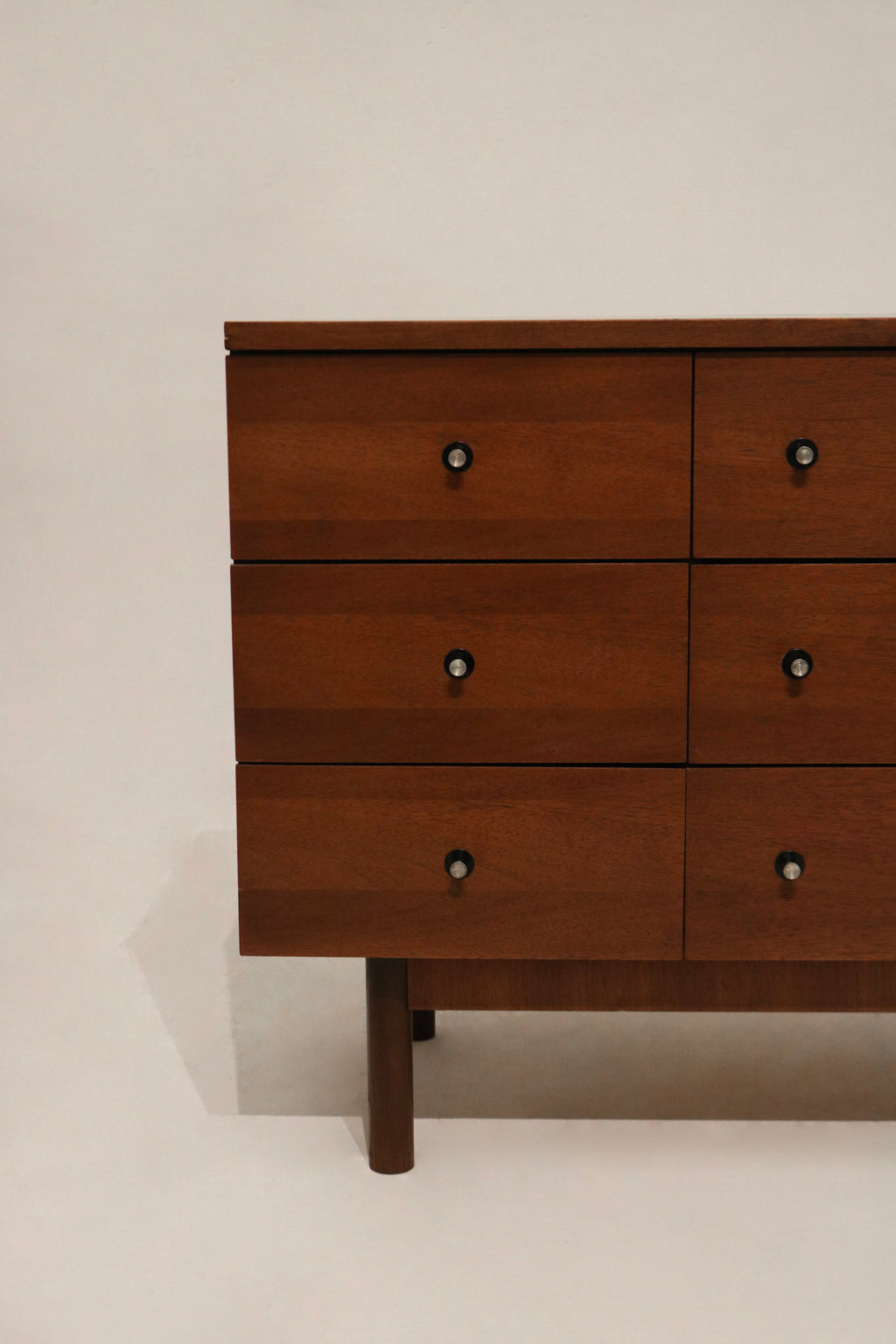 Corner detail emphasizing the dresser’s precise craftsmanship and solid walnut edges