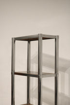 Close-up of glass and wood interaction on middle shelf enhancing the design contrast