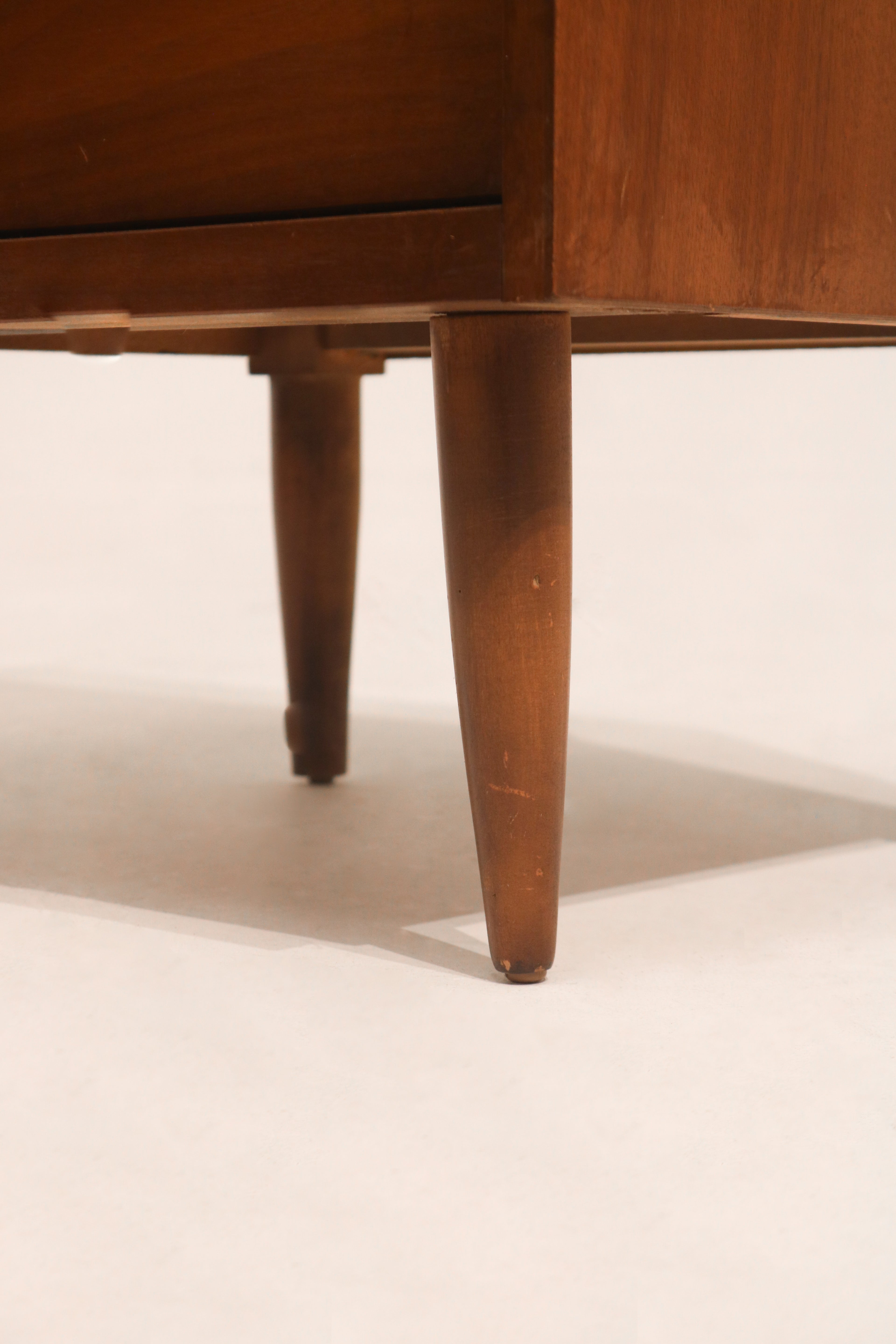 Side angle showing depth and warm walnut color of mid-century nightstand