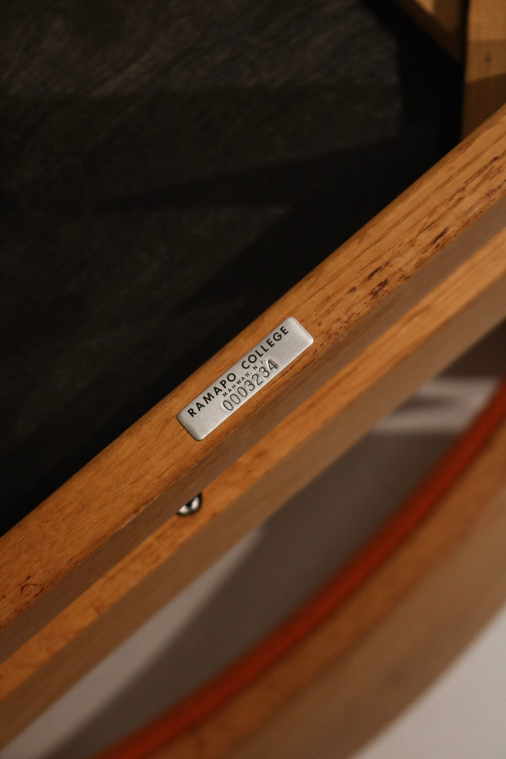 Underside view revealing solid wood support rails, original hardware and sturdy construction of the Jasper chair frames and seats.
