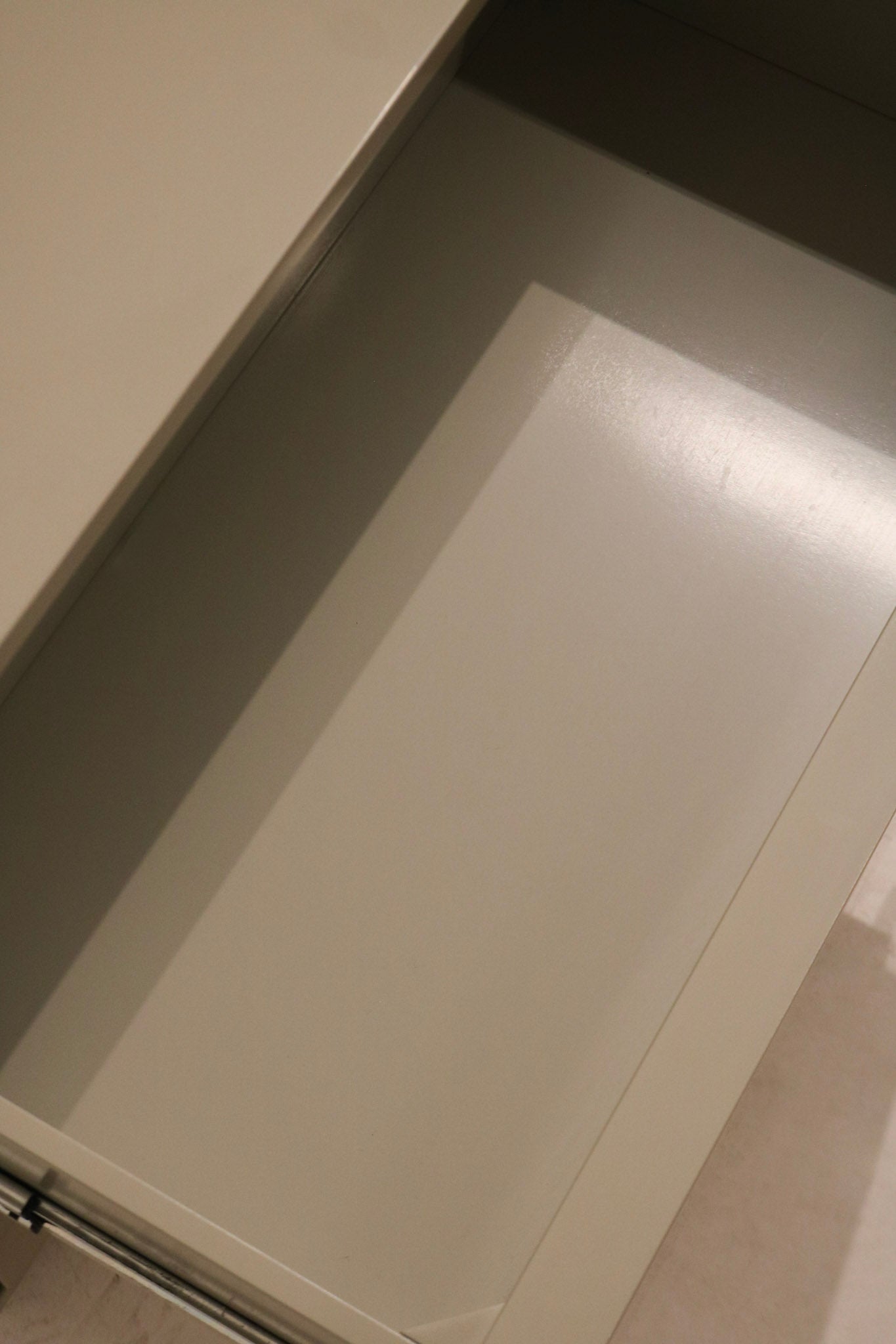 Legs and base close-up, showcasing support design and continuity in finish