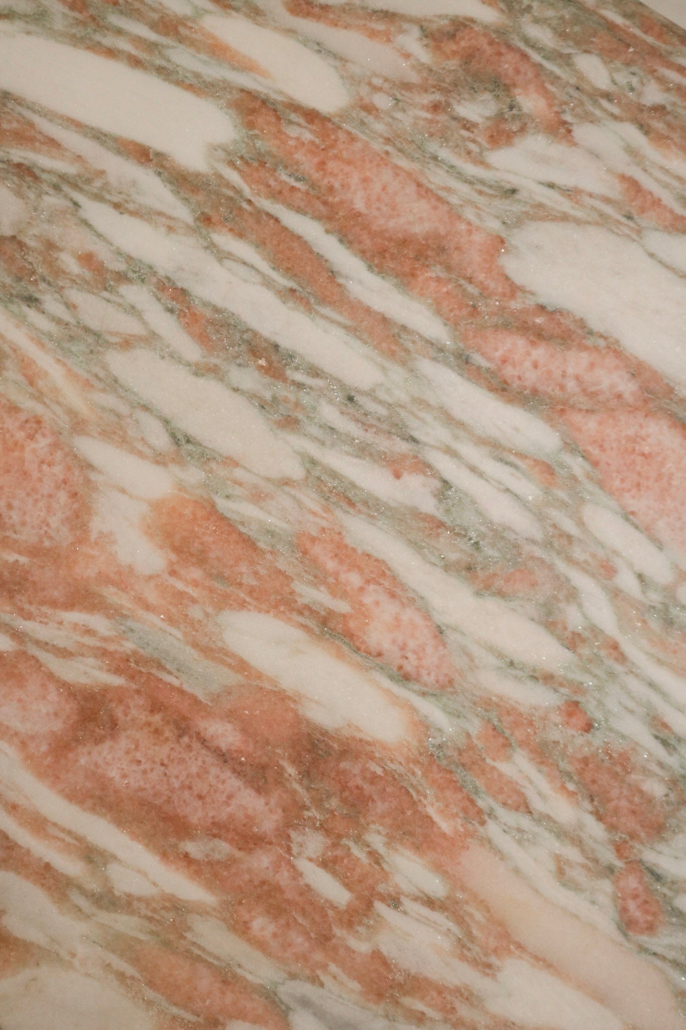 Edge and corner detail of solid marble table showing thickness, smooth polished edge and contemporary clean-cut profile.