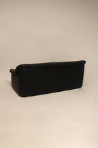 Close-up of Italian leather sofa showing smooth leather surface and stitching details