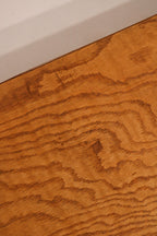 Highlight of side wood panel showing mild wear spots and structurally sound build