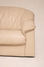 Close-up of corner section of beige leather Salotti Natuzzi sofa highlighting stitching details