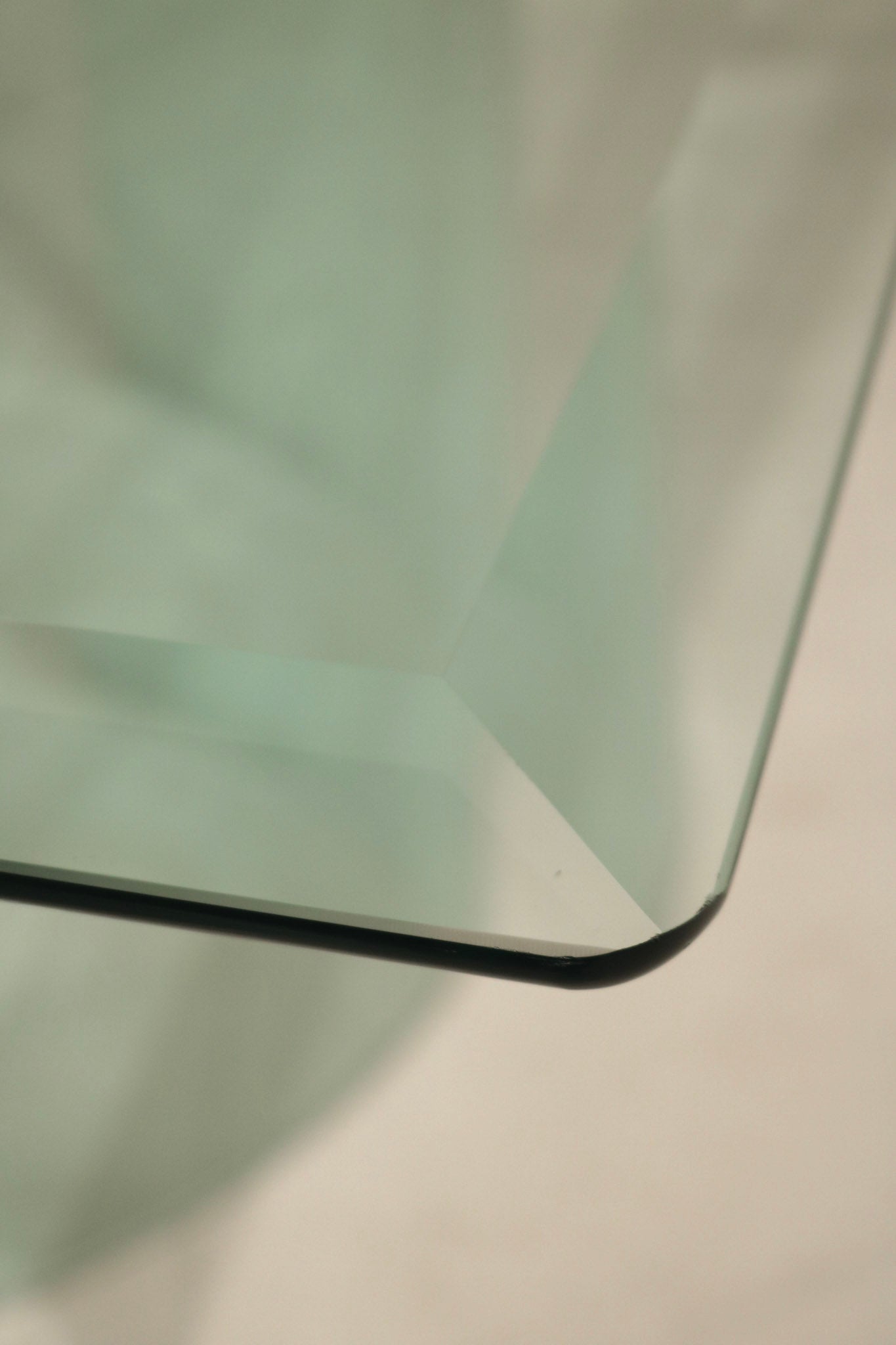 Side angle of Vintage Square Glass Coffee Table showing thickness and transparency of the glass material