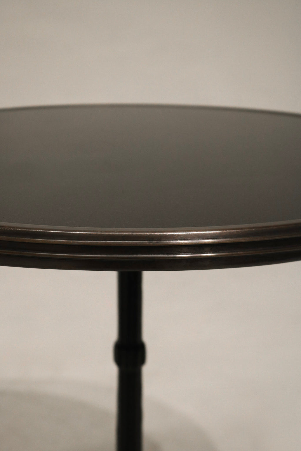 Detailed shot of the stone surface on Vintage Bistro Table revealing rich texture and natural tones