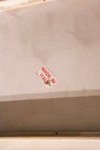 Postmodern corner detail of fiberglass coffee table, capturing Italian lacquer craftsmanship