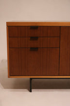 Close-up of plywood drawers with walnut fronts, showing practical storage and sturdy build