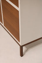 Angle shot of cabinet highlighting iron legs and heavy-duty wood construction