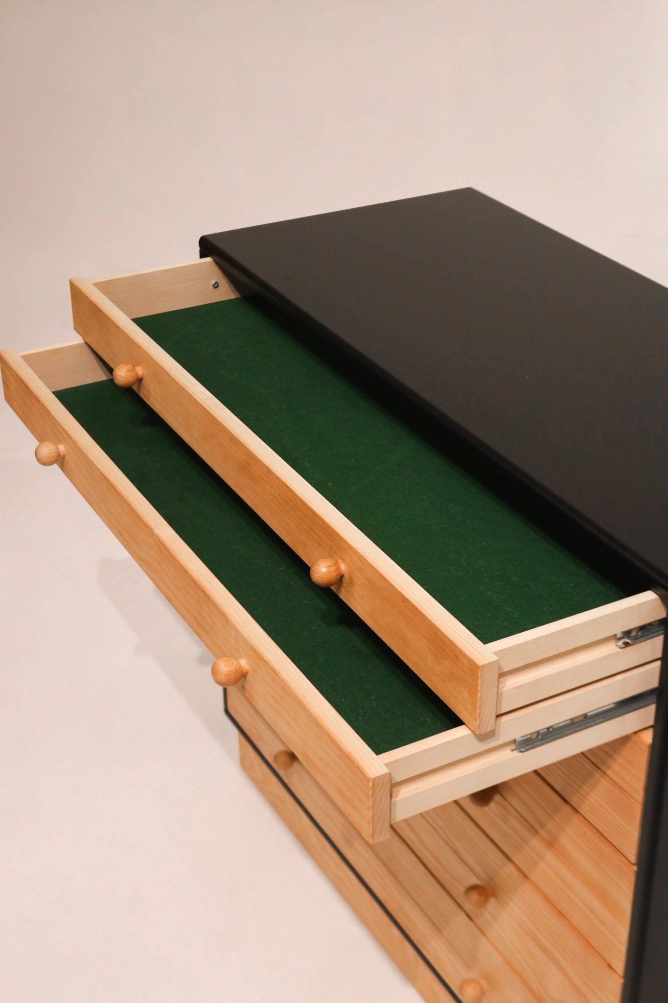 Backside of wood dresser with visible 'Made in Denmark' watermark