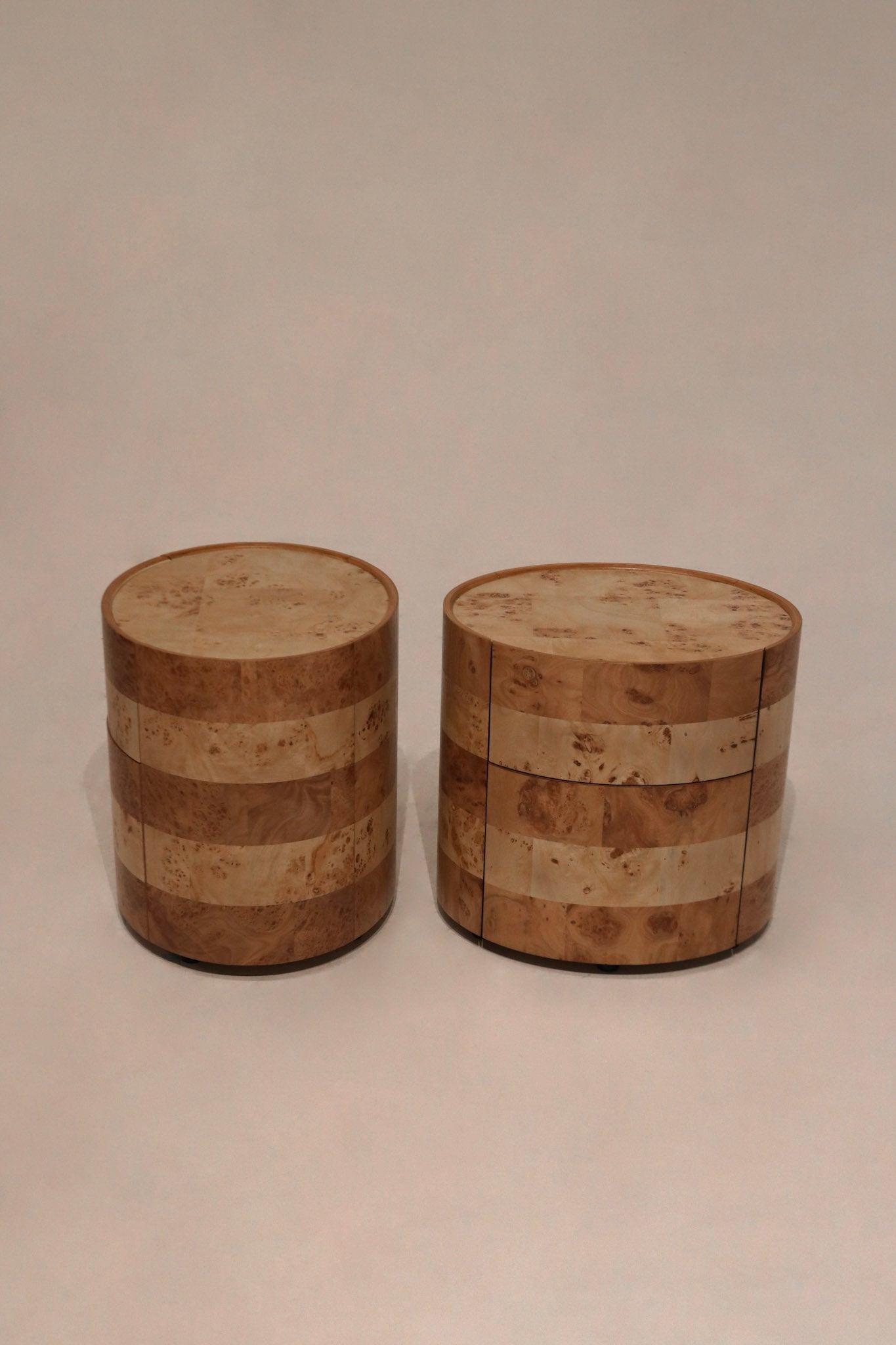 Side angle of both nightstands highlighting bentwood construction and burl veneer panels