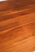 Side profile of the table emphasizing the natural wood edge and robust build