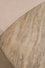 Top view showing veined marble surface with white and beige natural stone tones