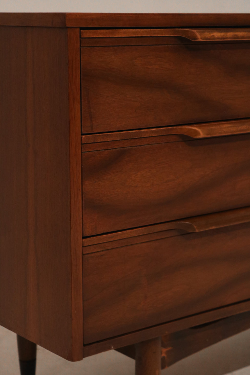 Angled view of the MCM dresser structure with solid wood frame and clean lines