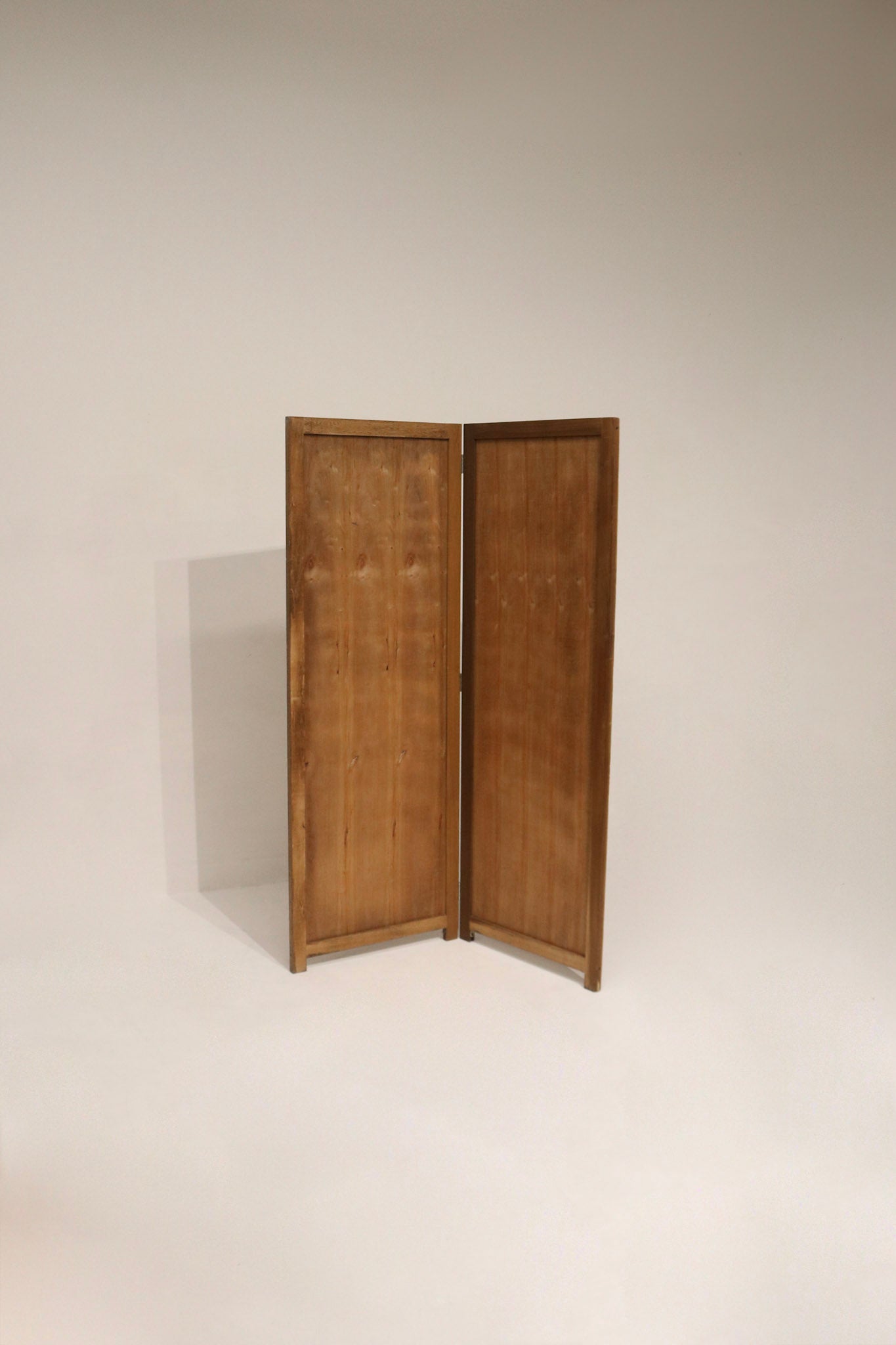 Full view of vintage pine wood folding screen room divider showing three-panel design, natural grain, warm finish.