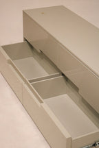 Lighting highlight across dresser surface showing luster of lacquer finish