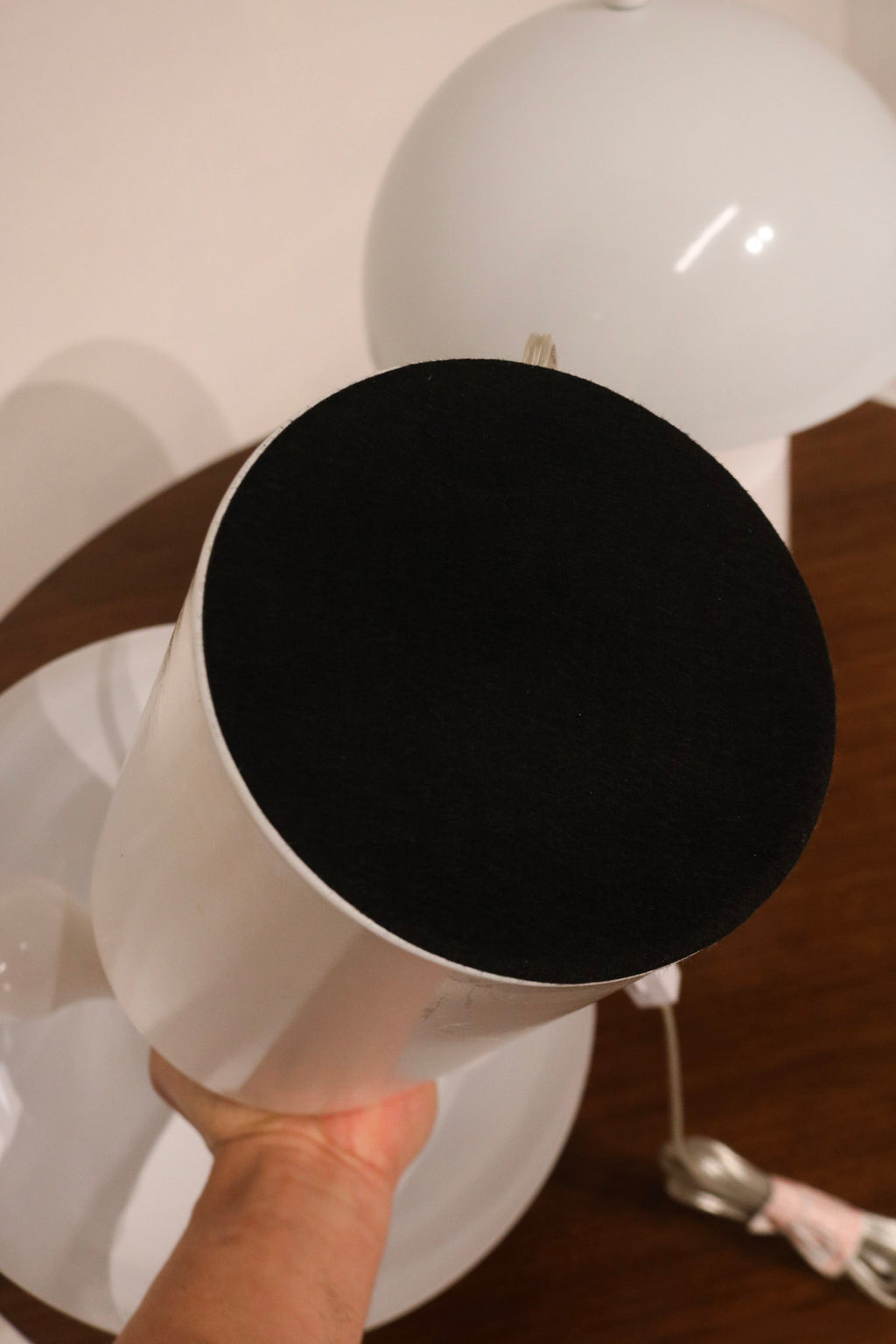 Close-up of smooth white metal dome shade on the mushroom table lamps with modern finish