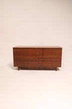 Full view of Mcm vintage walnut wood lowboy dresser by Stanley with six drawers and mid-century design