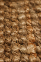 Close-up of the finely woven jute texture on the Contemporary Boho Area Rug, natural fiber detail