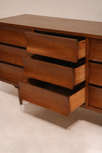Overhead photo of dresser’s top surface showing wood grain and veneer pattern