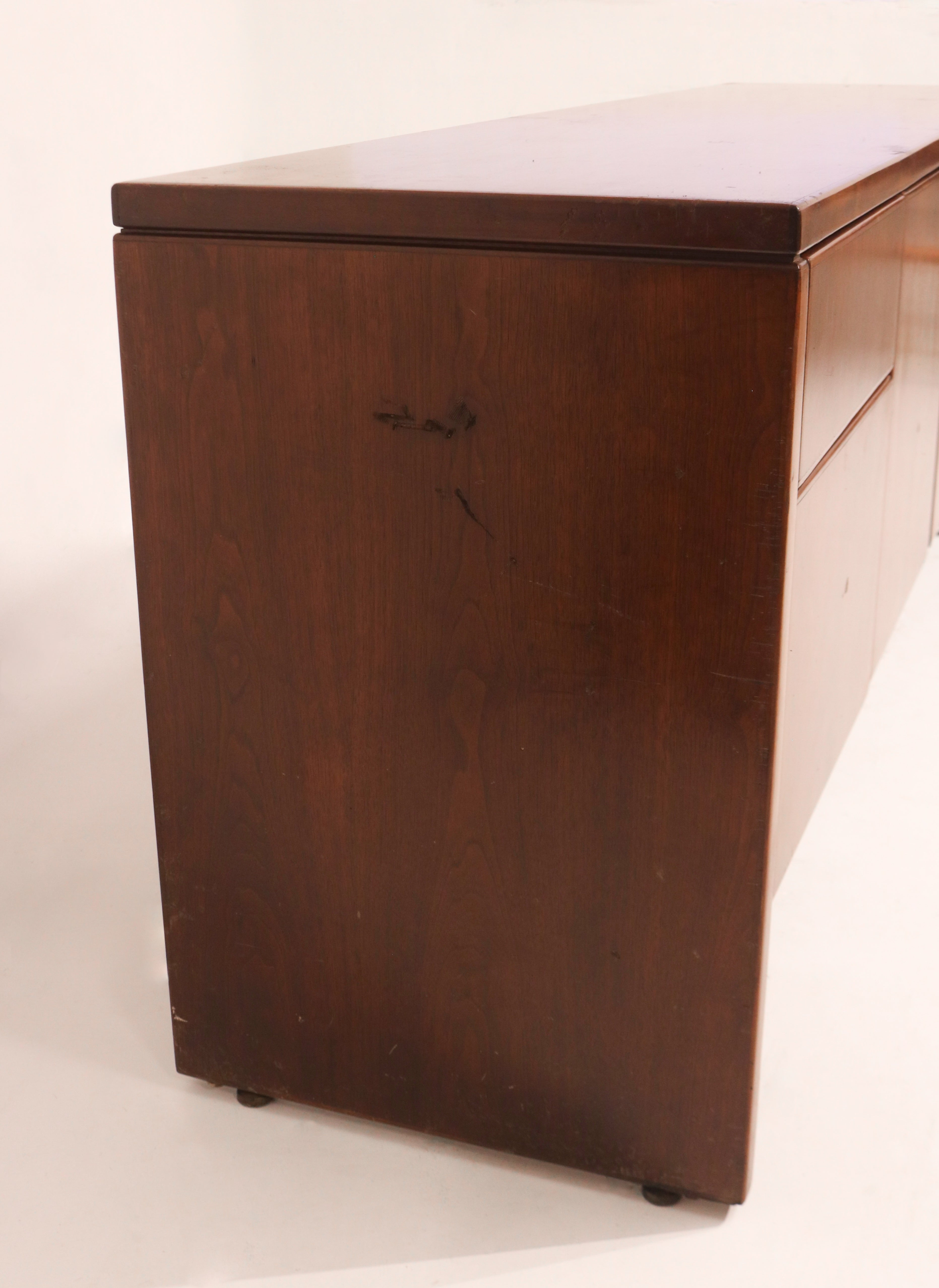 Underside view of credenza showing frame construction and leg alignment in hardwood
