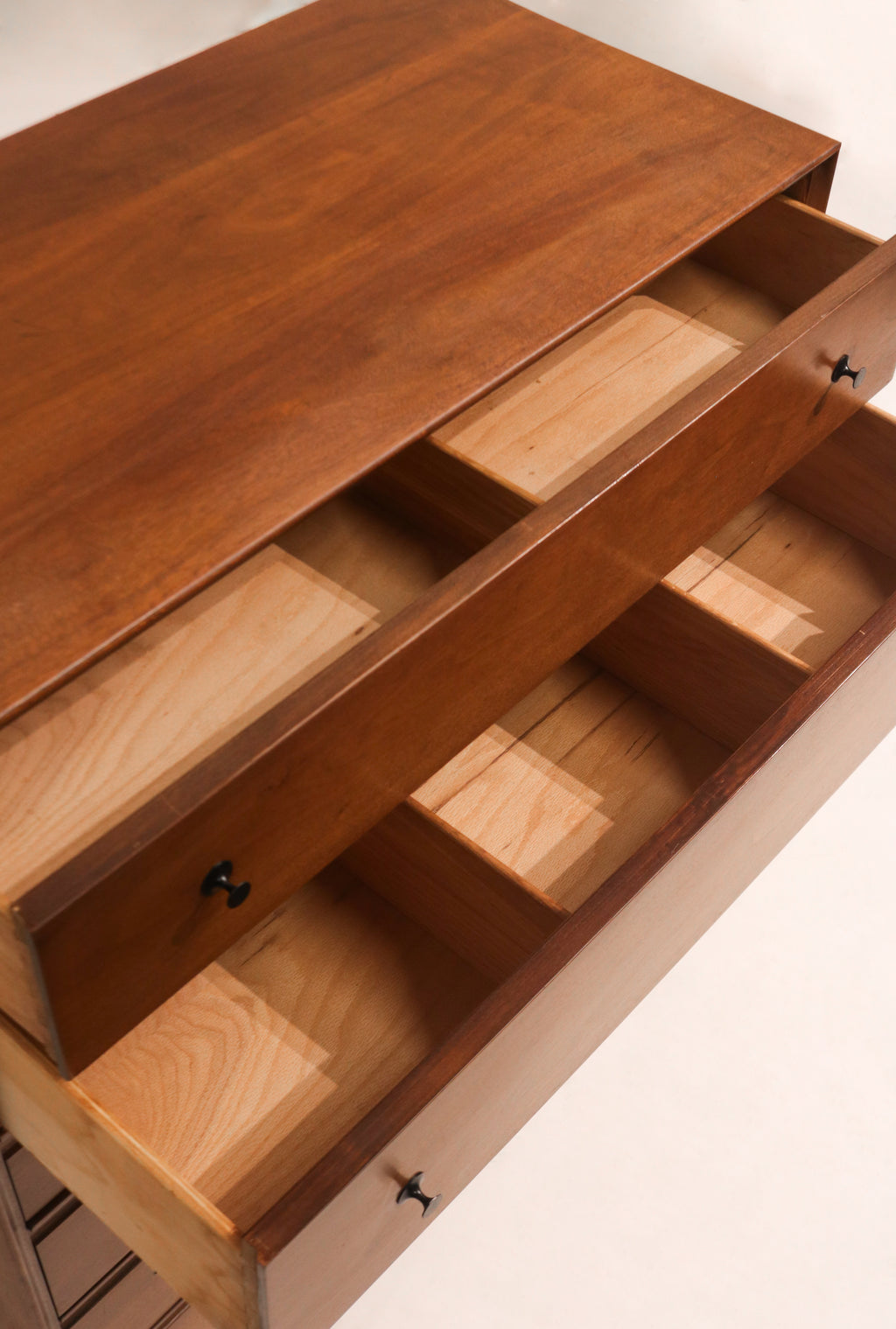 Side view of the highboy dresser showing clean lines and mid century modern silhouette