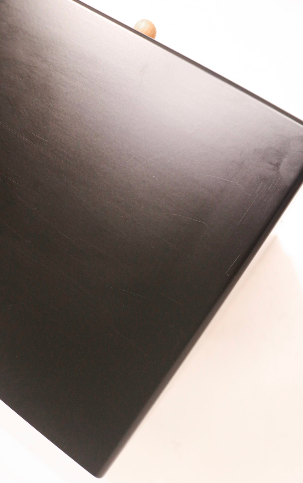 Zoom-in on top surface with subtle wood grain patterns and smooth finish