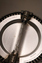 Close-up of lamp switch and control area, featuring clean metal design and functionality