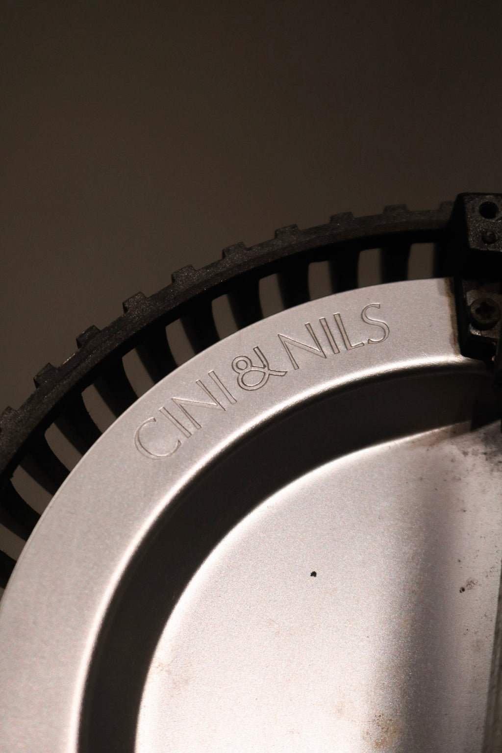 Angled shot of the lamp's upper section with bulb fixture and minimalist finishes