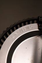 Angled shot of the lamp's upper section with bulb fixture and minimalist finishes