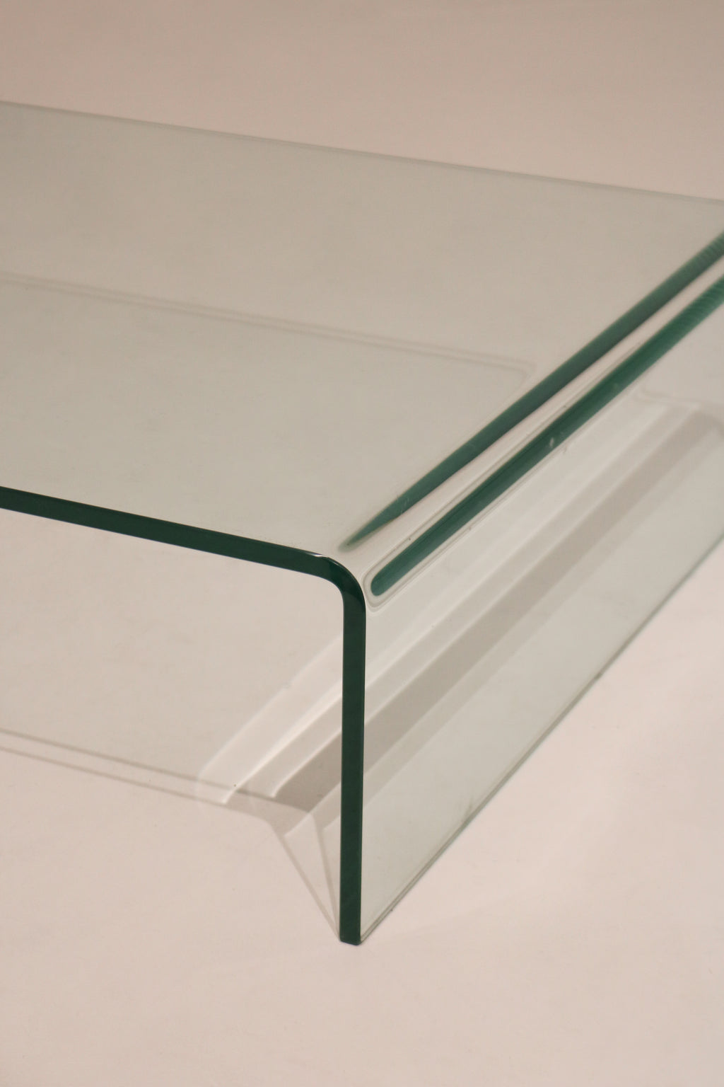 Contemporary Modern glass waterfall coffee table showing full dimensions 55 inches long by 28 deep by 9 high