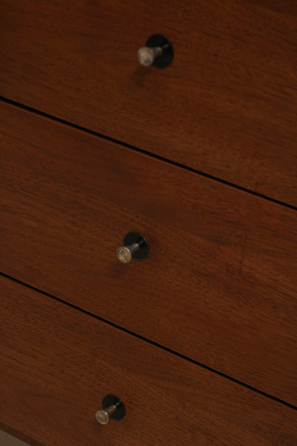 Detailed view of the sturdy walnut wood drawer construction and dovetail joints