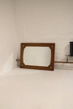 Metal hanging hardware on oak wood frame, vertical brackets shown; adaptable for horizontal display and secure wall mounting.
