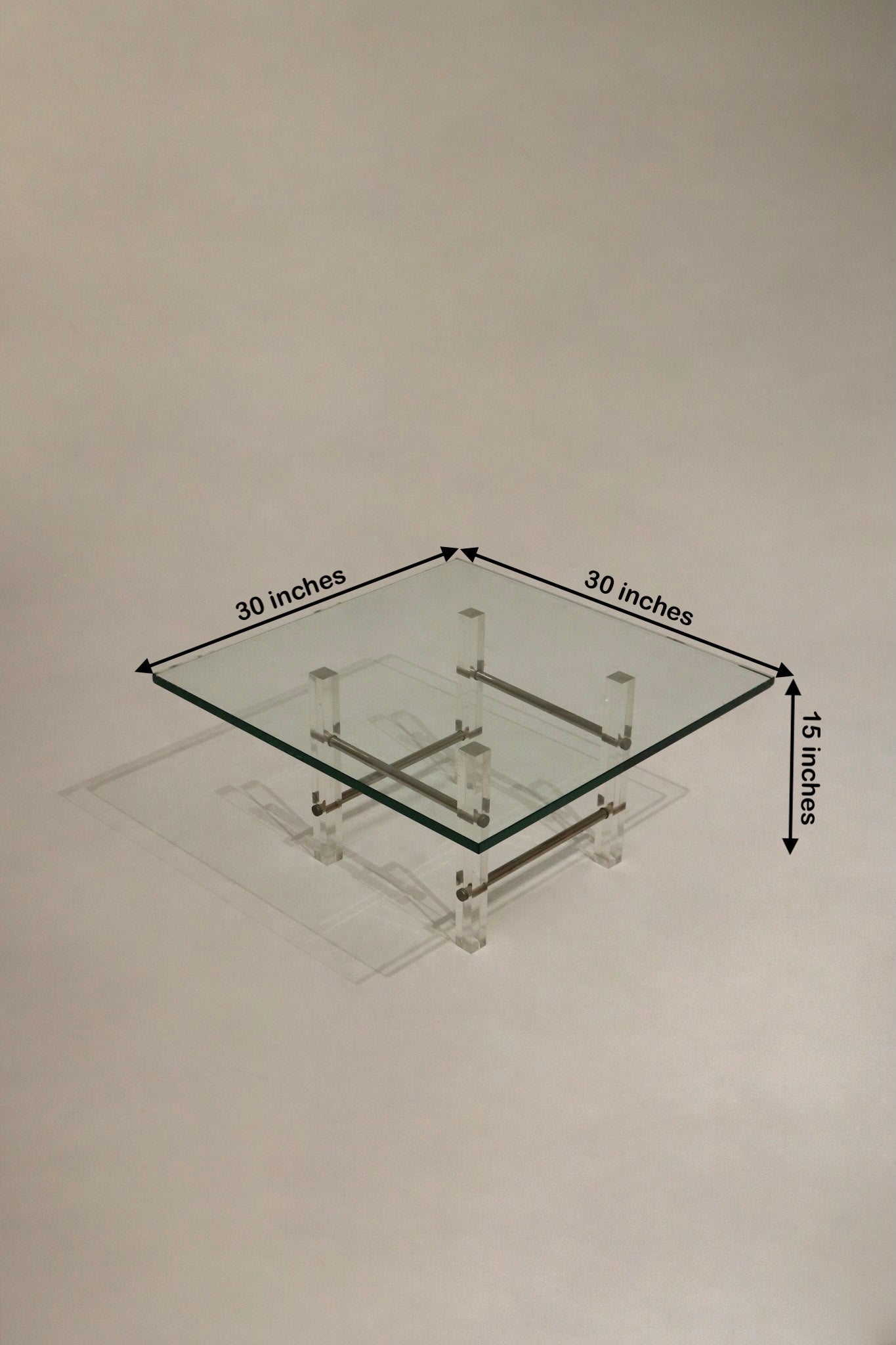 Stylish Lucite coffee table with glass top