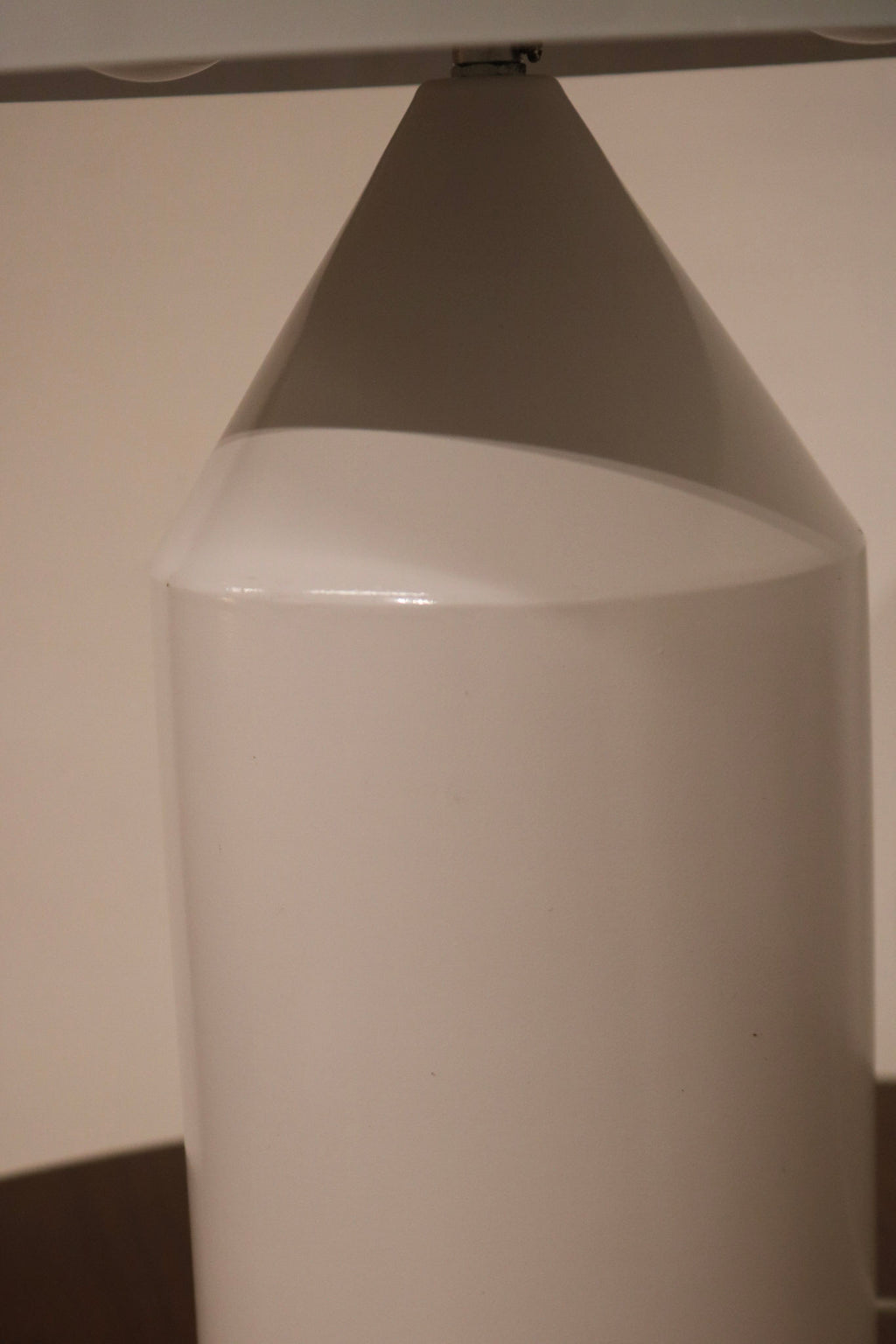 Top view of mushroom lamp dome highlighting matte white metal finish and clean edges