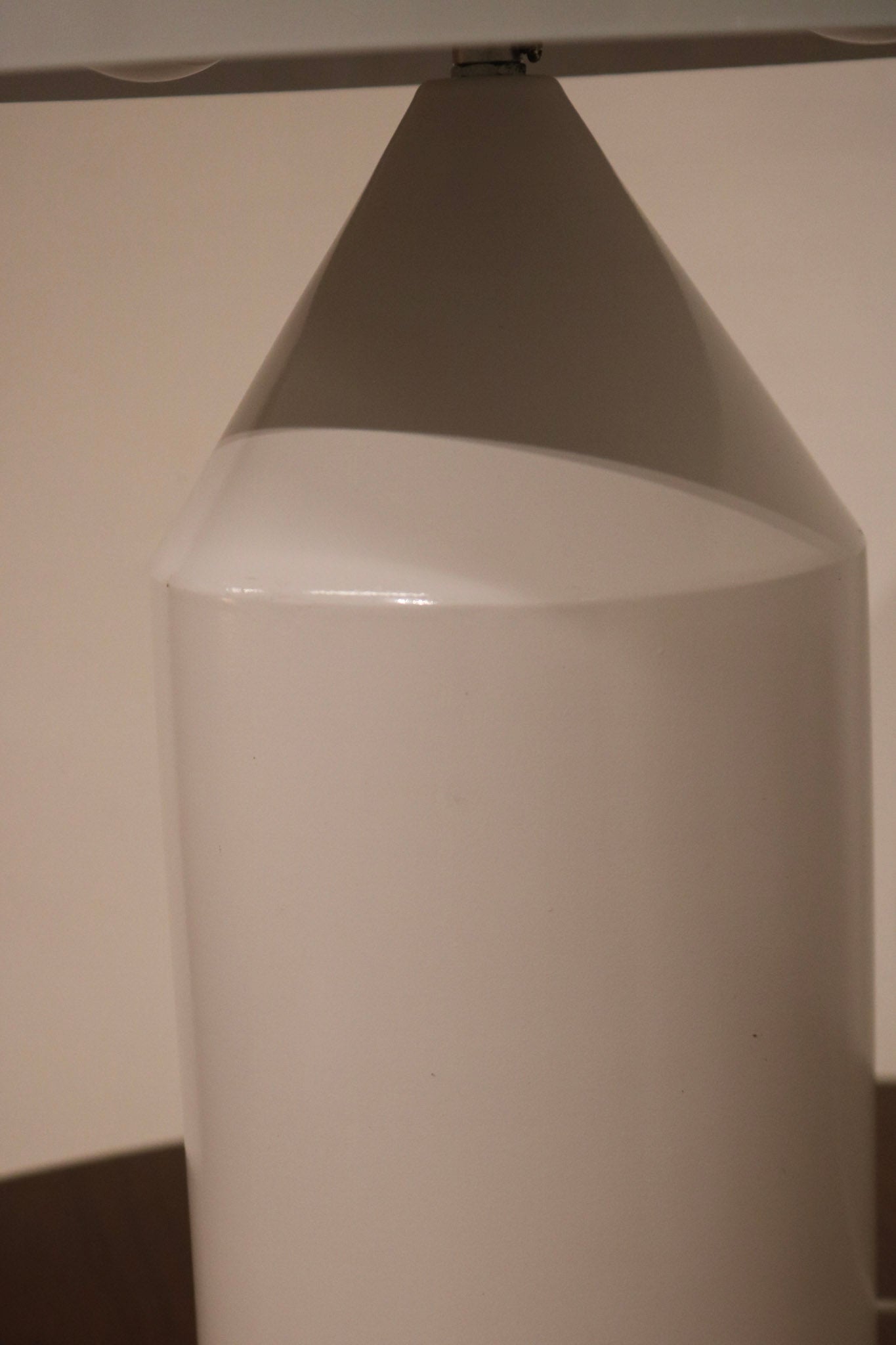 Top view of mushroom lamp dome highlighting matte white metal finish and clean edges