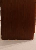 Detailed image of mid-century style legs supporting the Danish teak wood low dresser