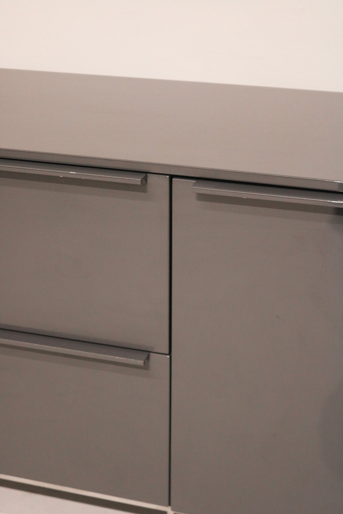 Close-up of high-gloss lacquered wood surface on Capellini contemporary TV cabinet