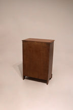 Close-up of drawer front showcasing the rich maple grain and quality hardware