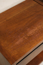 Construction detail: drawer runners, edge banding and joinery on walnut nightstands, illustrating durable mid-century build