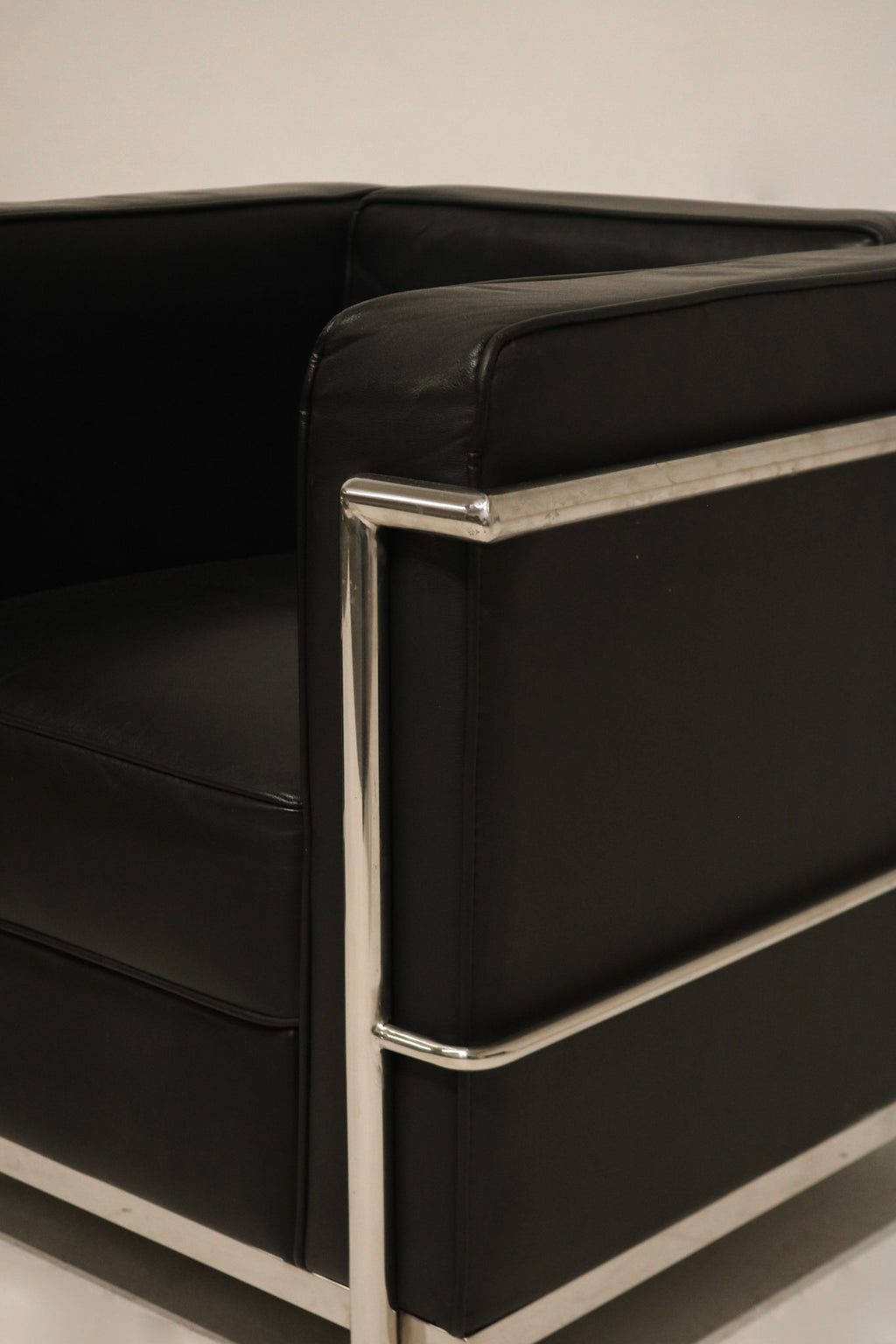 Angular view showing depth and layout of the chrome frame and cushions