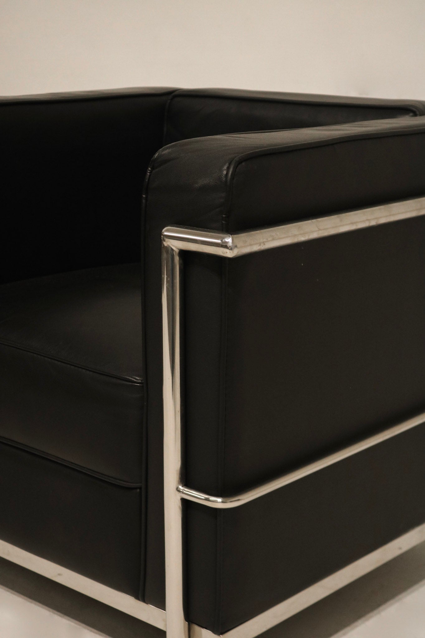 Angular view showing depth and layout of the chrome frame and cushions